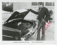 9s1177 WILLIAM DEVANE signed 8.25x10.25 still 1977 getting rifle from car trunk in Rolling Thunder!