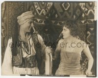 9t0975 SHEIK 8x10 still 1921 smiling Rudolph Valentino grabs Agnes Ayres' hand holding dagger!