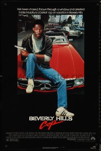 9w1092 BEVERLY HILLS COP 1sh 1984 great image of detective Eddie Murphy sitting on red Mercedes!