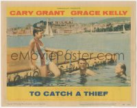 9y0871 TO CATCH A THIEF LC #1 1955 Grace Kelly & Cary Grant swim on the Riviera, Alfred Hitchcock
