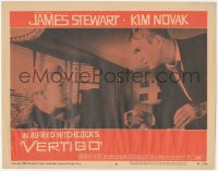 9y0886 VERTIGO LC #8 1958 Alfred Hitchcock, standing James Stewart glares at blonde Kim Novak!