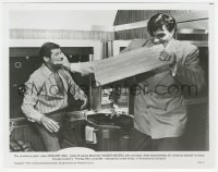 1a1565 SPY WHO LOVED ME 8x10.25 still 1977 Kiel as Jaws holds Moore as James Bond as he bites board!