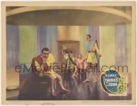 1a0876 THINGS TO COME LC 1936 Raymond Massey & others wearing wacky clothes of the future, rare!