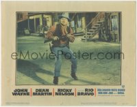1b2043 RIO BRAVO LC #7 1959 close up of John Wayne with rifle in middle of street, Howard Hawks!