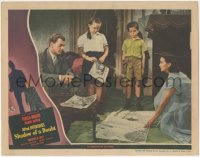 1f0697 SHADOW OF A DOUBT LC 1943 Joseph Cotten watches Teresa Wright spread newspapers on floor!