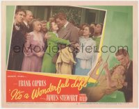 1h0323 IT'S A WONDERFUL LIFE LC #5 1946 James Stewart hugging Donna Reed at wedding, Frank Capra!