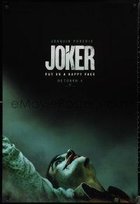 1w0983 JOKER teaser DS 1sh 2019 close-up image of clown Joaquin Phoenix, put on a happy face!