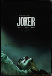 2c1113 JOKER teaser DS 1sh 2019 close-up image of clown Joaquin Phoenix, put on a happy face!