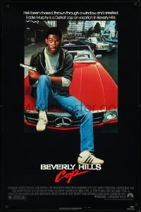 2g1066 BEVERLY HILLS COP 1sh 1984 great image of detective Eddie Murphy sitting on red Mercedes!