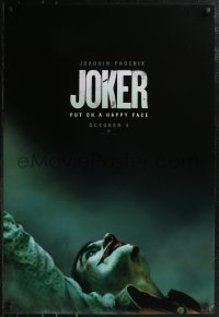 2g1224 JOKER teaser DS 1sh 2019 close-up image of clown Joaquin Phoenix, put on a happy face!