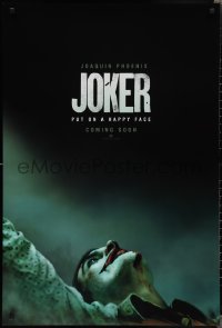 2g1225 JOKER int'l teaser DS 1sh 2019 close-up image of clown Joaquin Phoenix, put on a happy face!