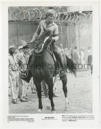 2h0947 ROBERT REDFORD signed 8x10.25 still 1980 on horseback in prison yard in Brubaker!