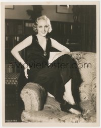 2j1744 CAROLE LOMBARD 8x10 key book still 1930s wearing black velvet gown & seated on chair arm!