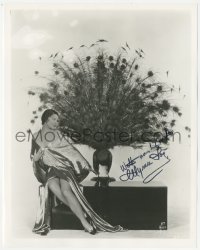 2j0322 MYRNA LOY signed 8x10 REPRO still 1980s sexy full-length portrait sitting by stuffed peacock!