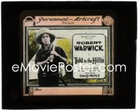 2j1711 TOLD IN THE HILLS glass slide 1919 great close up of Robert Warwick carrying pick axe!