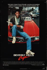 2k0867 BEVERLY HILLS COP 1sh 1984 great image of detective Eddie Murphy sitting on red Mercedes!