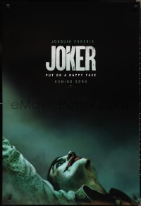 2k1110 JOKER int'l teaser DS 1sh 2019 close-up image of clown Joaquin Phoenix, put on a happy face!