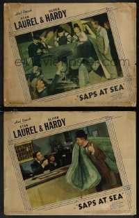 2p1556 SAPS AT SEA 2 LCs 1940 Stan Laurel carrying mattress & talking to receptionist + driving car!