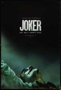 2r1006 JOKER teaser DS 1sh 2019 close-up image of clown Joaquin Phoenix, put on a happy face!