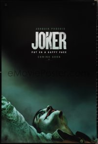 2r1007 JOKER int'l teaser DS 1sh 2019 close-up image of clown Joaquin Phoenix, put on a happy face!