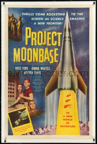 2s1144 PROJECT MOONBASE linen 1sh 1953 Robert Heinlein, cool art of rocket ship & wacky astronauts!