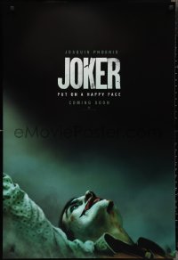 2w0986 JOKER int'l teaser DS 1sh 2019 close-up image of clown Joaquin Phoenix, put on a happy face!