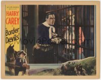 2y1107 BORDER DEVILS LC 1932 cowboy Harry Carey hands gun to man behind bars, ultra rare!
