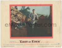 2y1144 EAST OF EDEN LC #1 1955 concerned James Dean running past sitting men, John Steinbeck, Kazan!