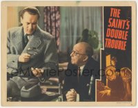 2y1297 SAINT'S DOUBLE TROUBLE LC 1940 man watches George Sanders examining clue w/ magnifying glass!