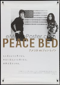 2z0563 U.S. VS. JOHN LENNON Japanese 29x41 2007 John & Yoko Ono, image in front of genocide poster!
