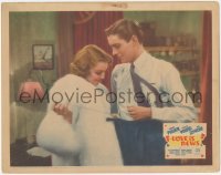 3b0535 LOVE IS NEWS LC 1937 c/u of Loretta Young in fur coat fixing Tyrone Power's clothes!
