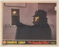 3f0772 SCARLET CLUE LC 1945 super close up of the masked villain pulling switch, Charlie Chan!