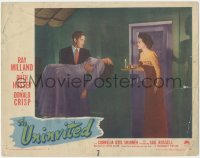 3p1352 UNINVITED LC #8 1944 Ruth Hussey with candle looks at Ray Milland carrying Gail Russell!