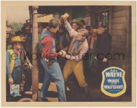 3p1364 WINDS OF THE WASTELAND LC 1936 crowd watching big John Wayne fighting with bad guy, rare!
