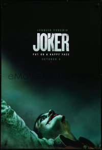 3r0820 JOKER teaser DS 1sh 2019 close-up image of clown Joaquin Phoenix, put on a happy face!