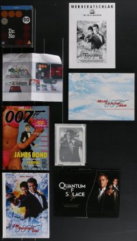 3s0204 LOT OF 14 MISCELLANEOUS JAMES BOND ITEMS 1980s-2020s Pierce Brosnan, Daniel Craig & more!