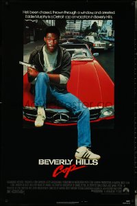 5c0559 BEVERLY HILLS COP 1sh 1984 great image of detective Eddie Murphy sitting on red Mercedes!