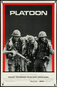 5c0795 PLATOON int'l 1sh 1986 Charlie Sheen & Quinn helping with soldier, Oliver Stone, Vietnam War!