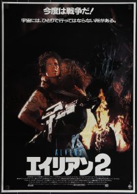 5g0376 ALIENS Japanese 1986 James Cameron sci-fi sequel, Sigourney Weaver as Ripley carrying Henn!