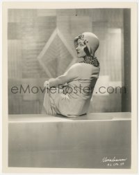 5r1846 WHAT A WIDOW 8x10.25 still 1930 Gloria Swanson seated on wall & looking over her shoulder!
