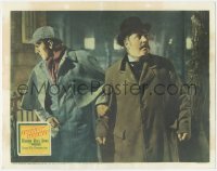 5r1121 ADVENTURES OF SHERLOCK HOLMES LC 1939 Basil Rathbone looking behind Nigel Bruce as Watson!