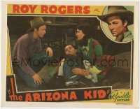 5r1134 ARIZONA KID LAMINATED LC 1939 close up of Roy Rogers & Sally March kneeling with wounded man!