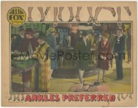 6b0423 ANKLES PREFERRED LC 1927 shopper glares at Madge Bellamy, who dropped all her packages!